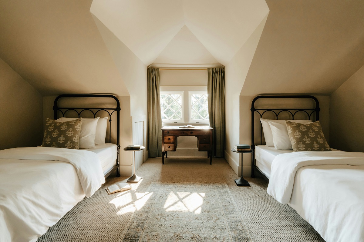 attic bedroom with two single beds